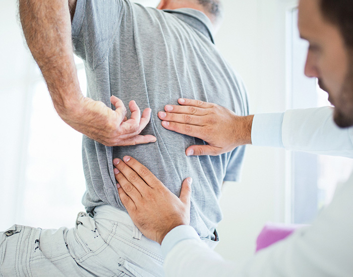 60 year old male doctor's office having medical examination